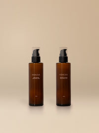 RISE and RESTORE Hand & Body Lotion Duo on a warm studio backdrop